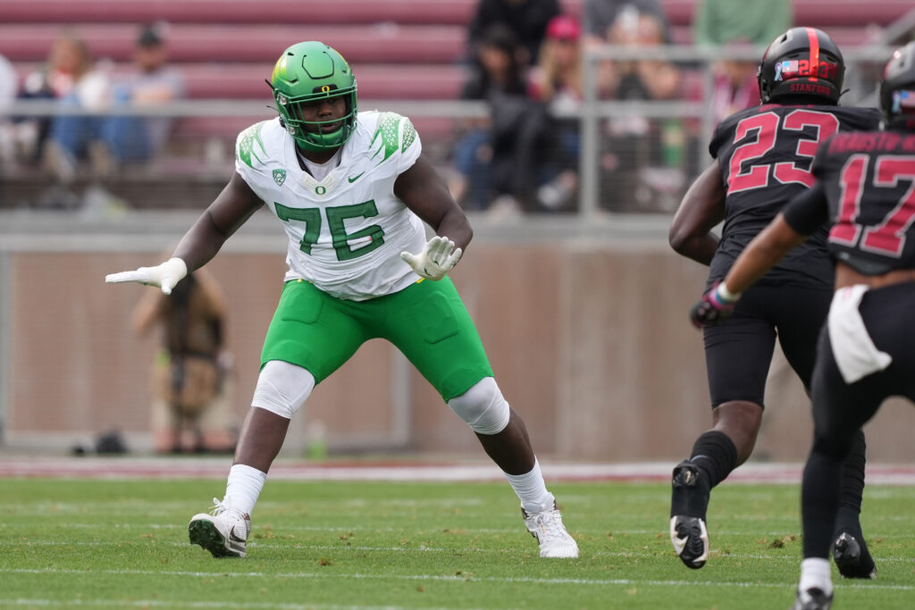 Oregon Ducks offensive lineman Josh Conerly Jr. (76) blocks against Stanford Cardinal linebacker David Bailey (23) during the second quarter at Stanford Stadium.