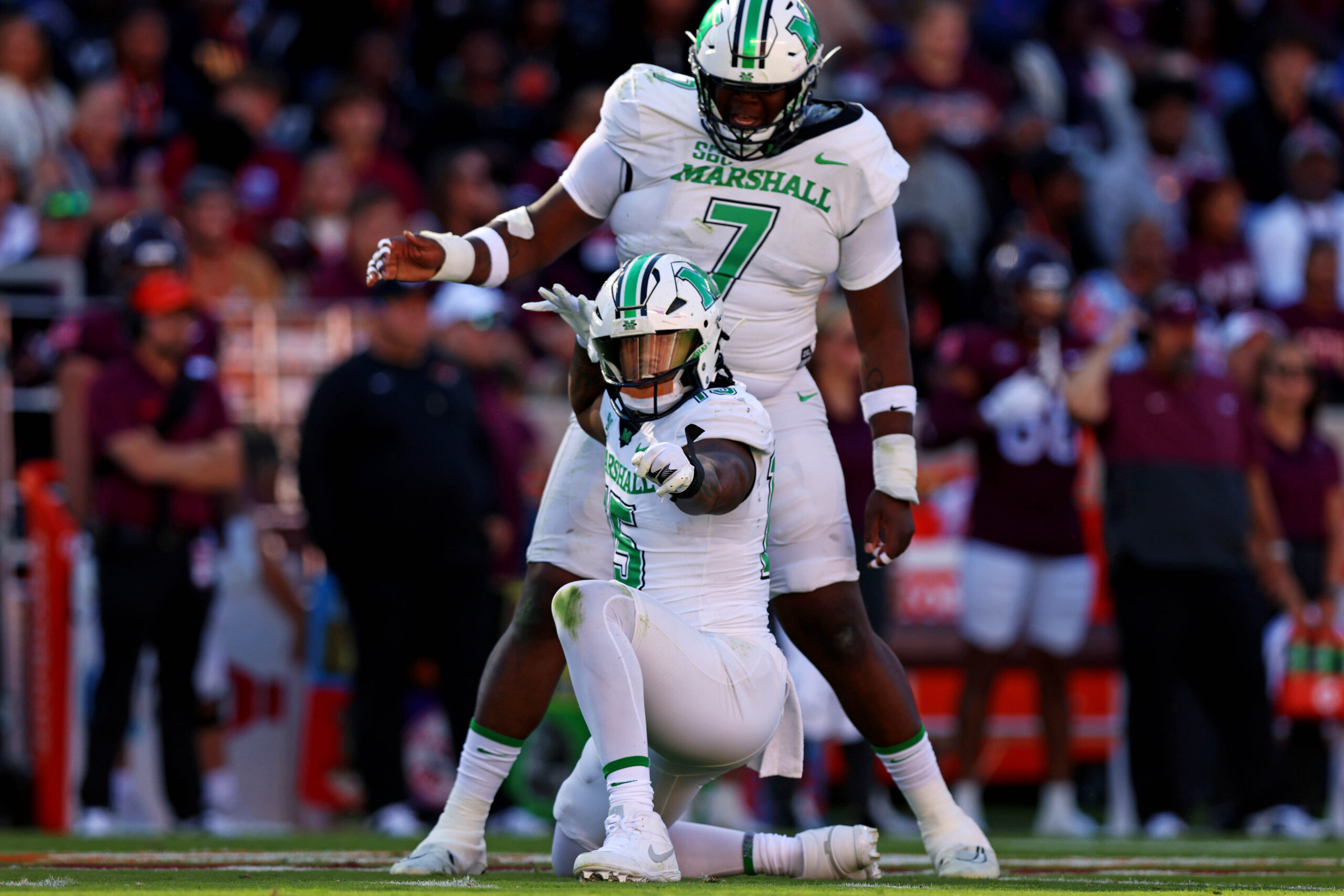 Marshall Thundering Herd defensive lineman Mike Green (15) celebrates after sacking Virginia Tech Hokies quarterback Kyron Drones (1) during the first quarter at Lane Stadium.