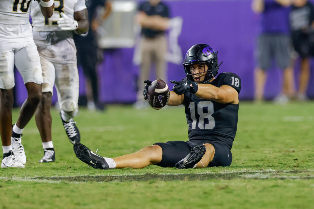 TCU Horned Frogs wide receiver Jack Bech (18) signals first down after a catch during the fourth quarter against the UCF Knights at Amon G. Carter Stadium. 