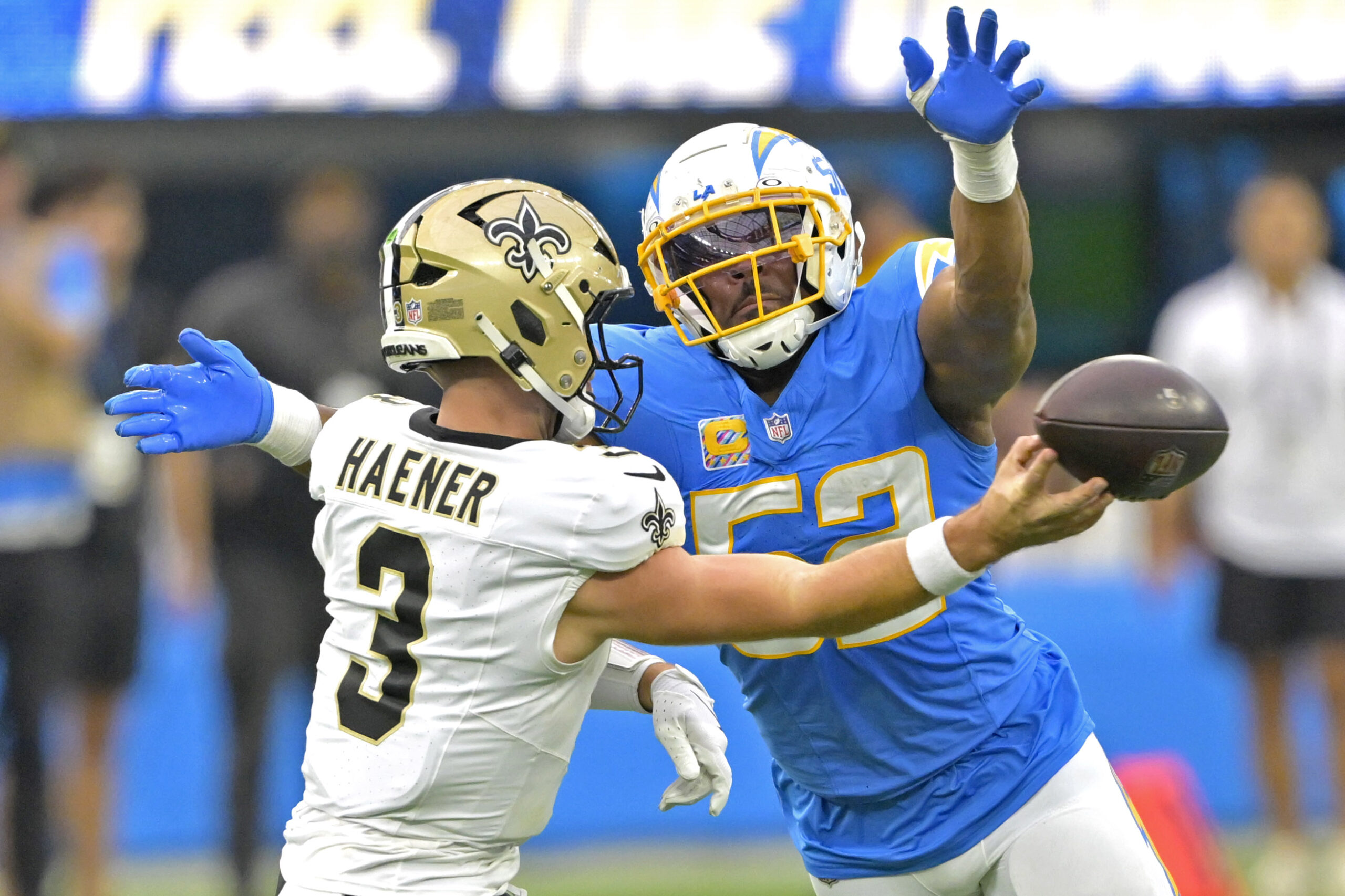 Los Angeles Chargers linebacker Khalil Mack (52) forces New Orleans Saints quarterback Jake Haener (3) to throw an incomplete pass in the second half at SoFi Stadium.