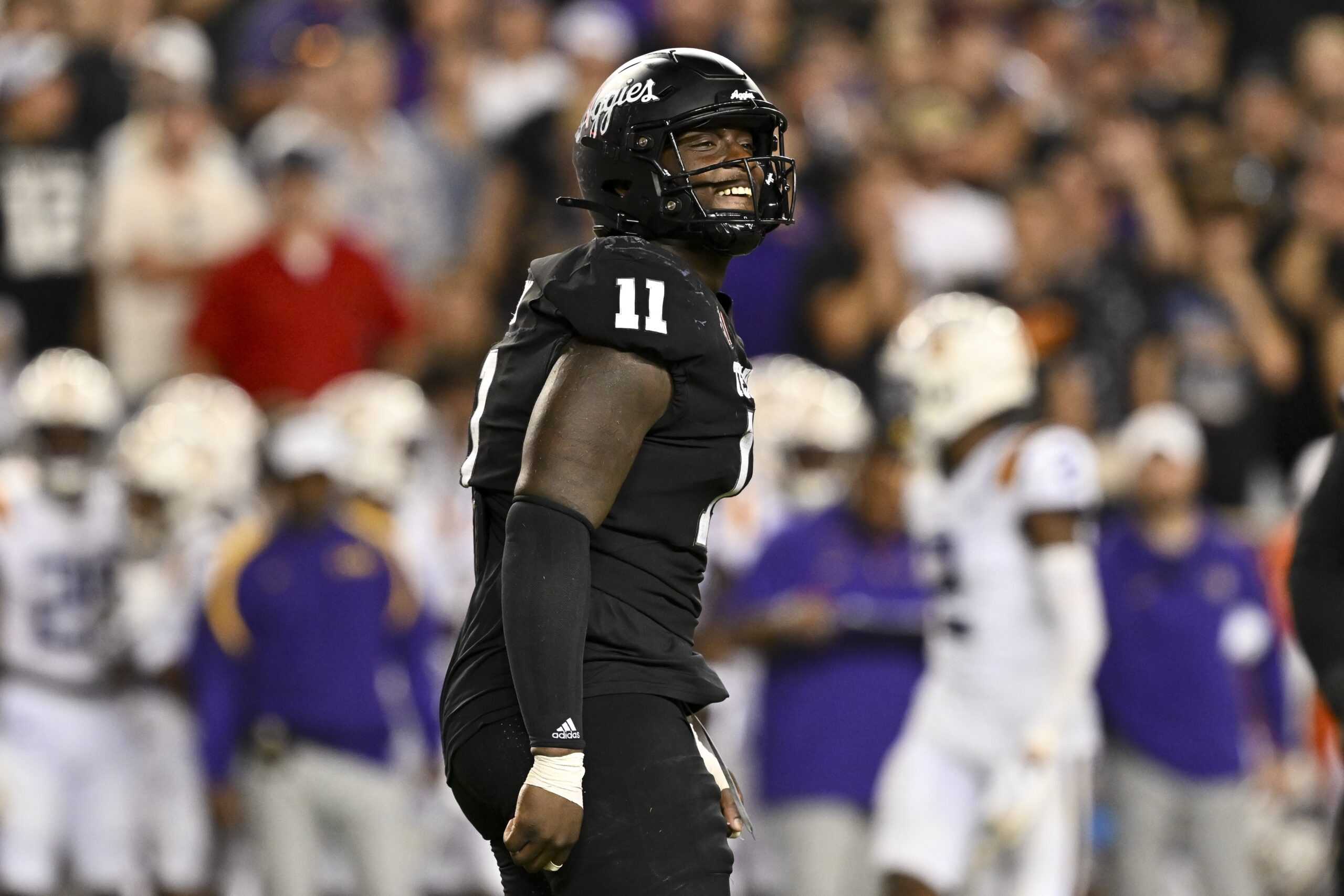 Aggies defensive lineman Nic Scourton (11) reacts against the LSU Tigers during the fourth quarter. The Aggies defeated the Tigers 38-23; at Kyle Field. Mandatory Credit: Maria Lysaker-Imagn Images.