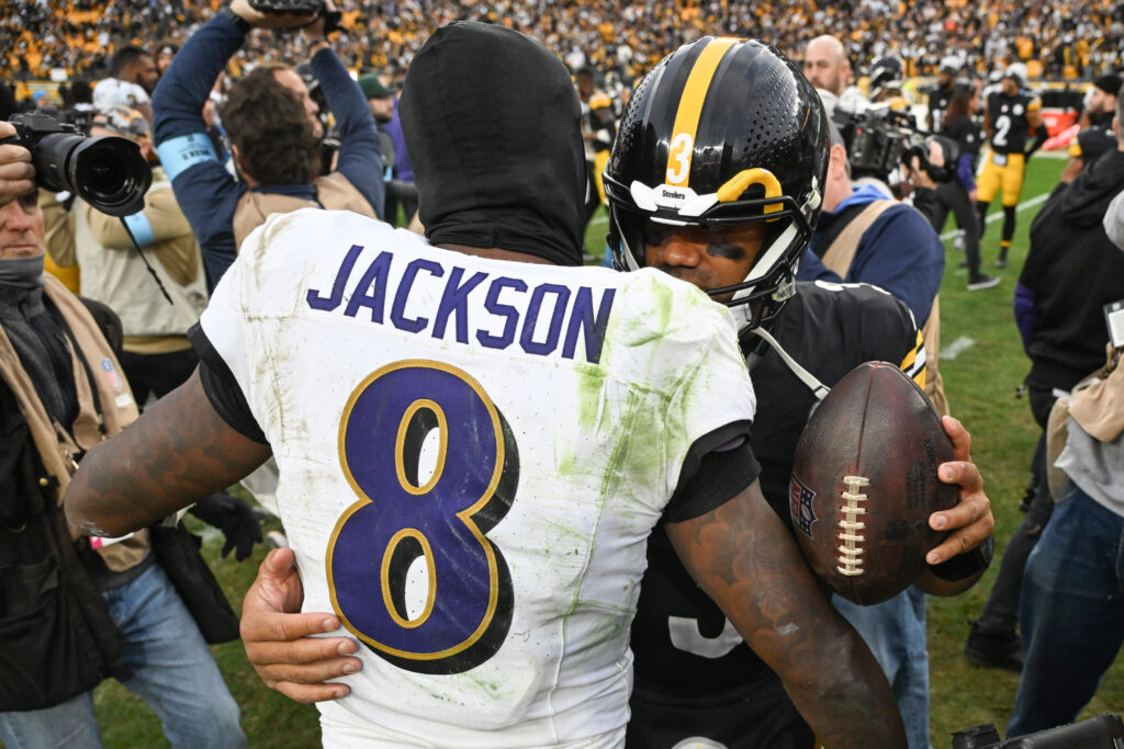 Pittsburgh Steelers quarterback Russell Wilson (3) hugs Baltimore Ravens quarterback Lamar Jackson (8) following their game at Acrisure Stadium.