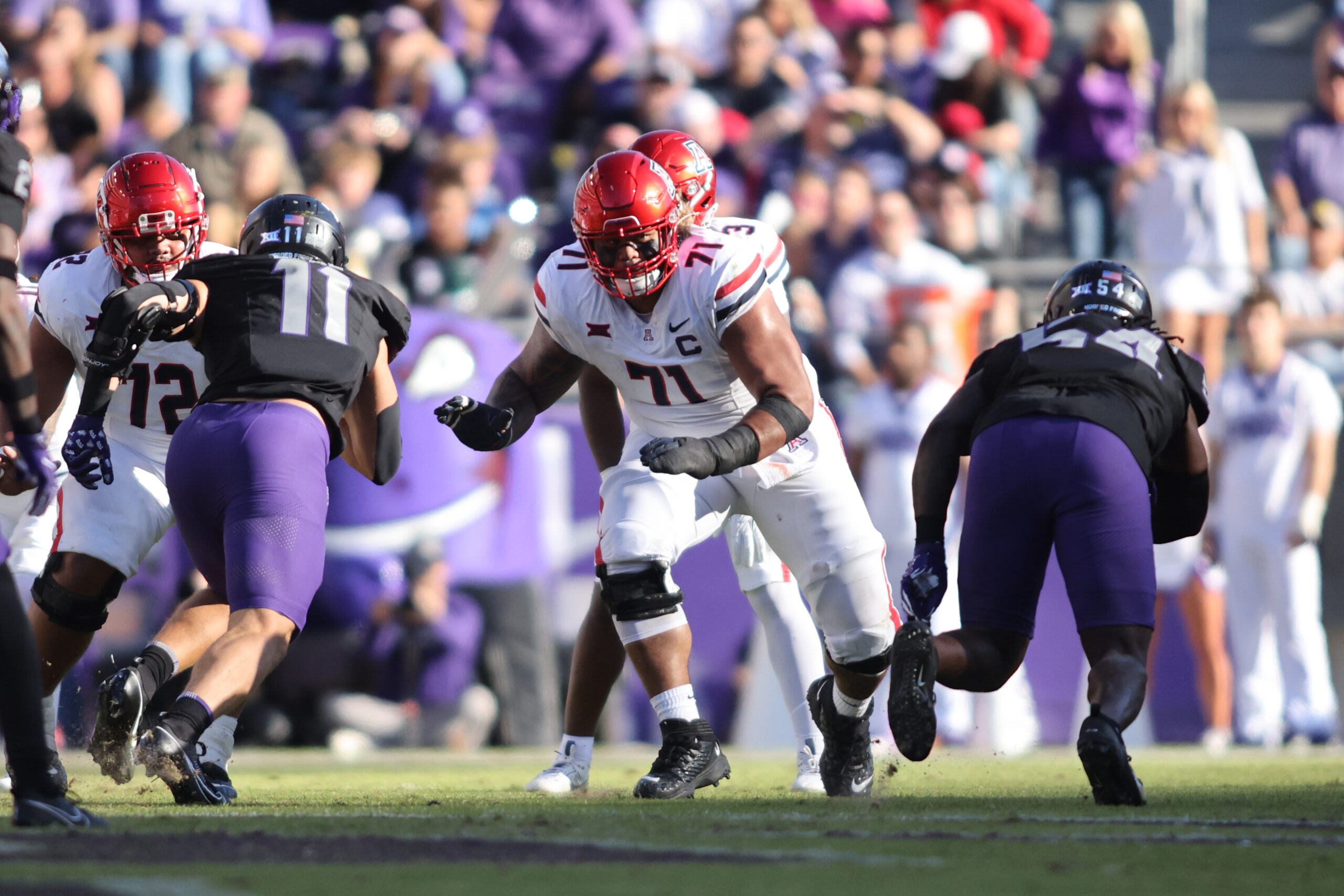 Arizona Wildcats offensive lineman Jonah Savaiinaea (71) blocks in the second quarter against the TCU Horned Frogs at Amon G. Carter Stadium.