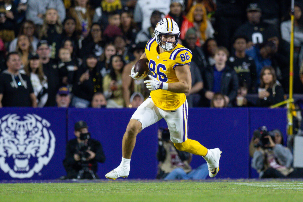 LSU Tigers tight end Mason Taylor (86) runs after a catch against the Vanderbilt Commodores during the first half at Tiger Stadium.