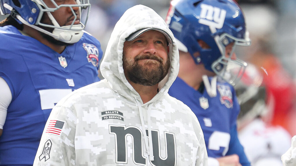 Brian Daboll makes a face while standing on the sideline.