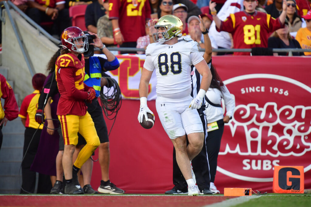 Notre Dame Fighting Irish tight end Mitchell Evans (88) scores a touchdown against the Southern California Trojans during the second half at the Los Angeles Memorial Coliseum.