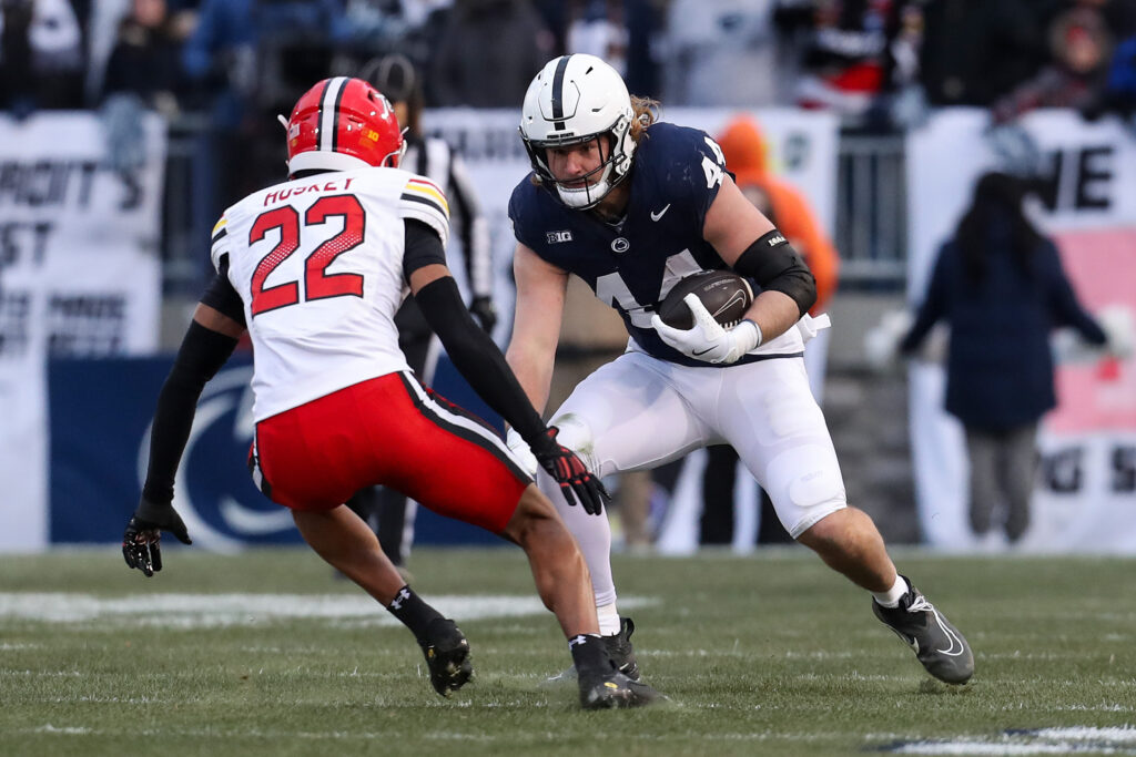 Penn State Nittany Lions tight end Tyler Warren (44) runs with the ball against Maryland Terrapins defensive back Jalen Huskey (22) during the first quarter at Beaver Stadium.