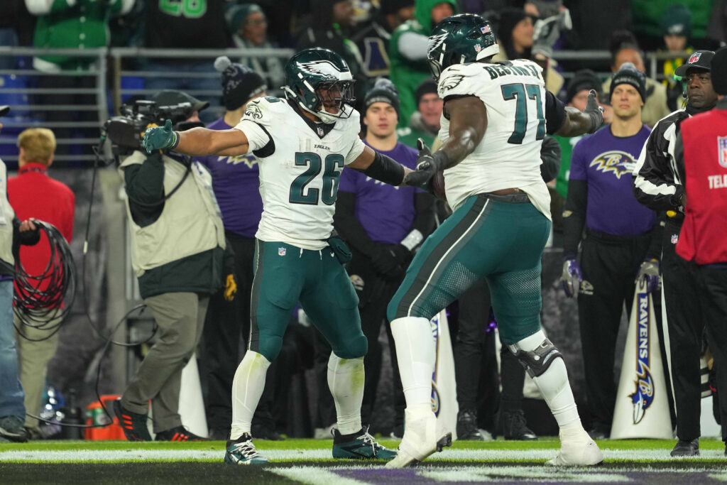 Philadelphia Eagles running back Saquon Barkley (26) celebrates his fourth quarter touchdown with tackle Mekhi Becton (77) against the Baltimore Ravens at M&T Bank Stadium. 