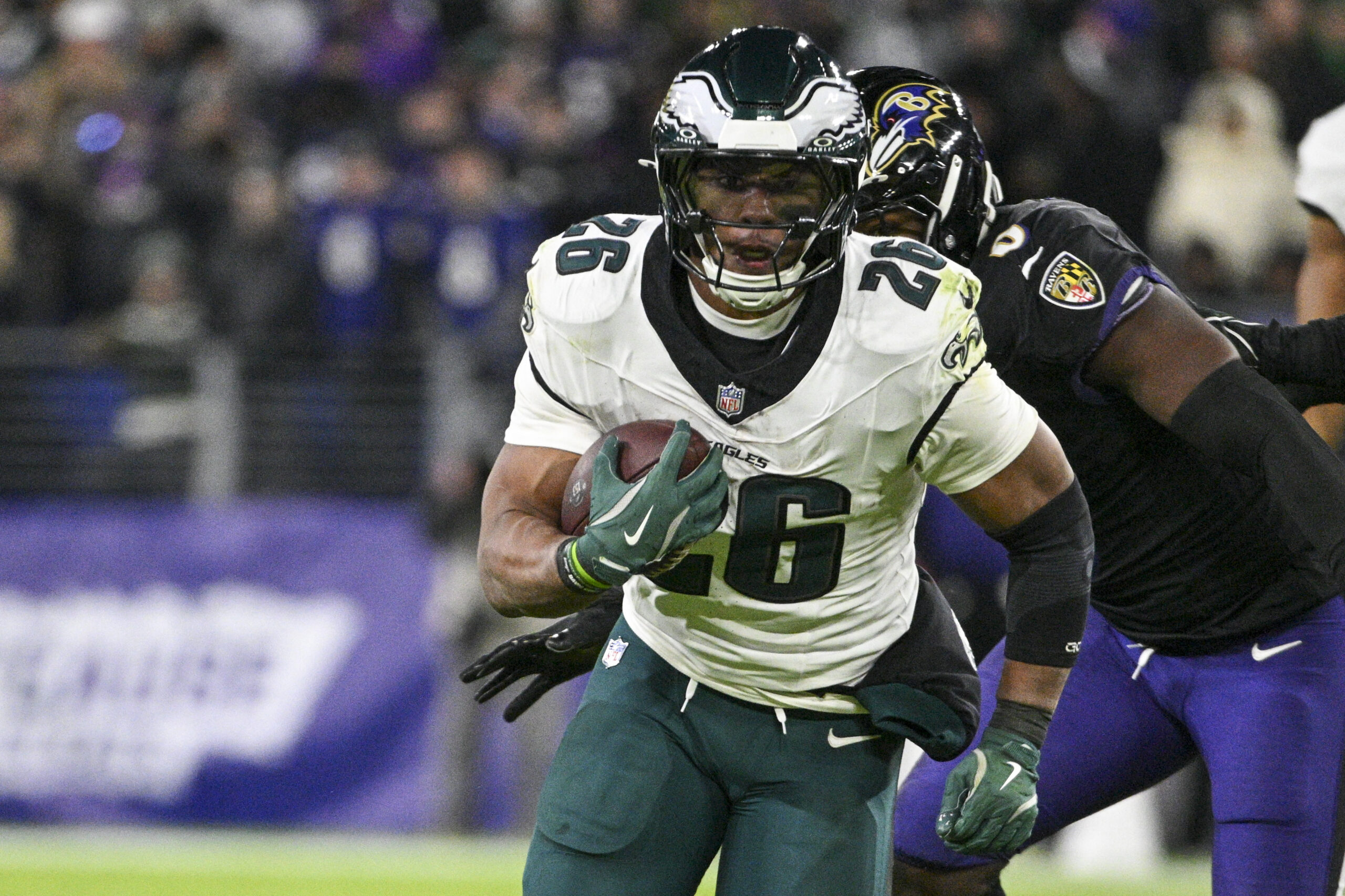 Philadelphia Eagles running back Saquon Barkley (26) rushes past Baltimore Ravens linebacker Roquan Smith (0) during the second half at M&T Bank Stadium.