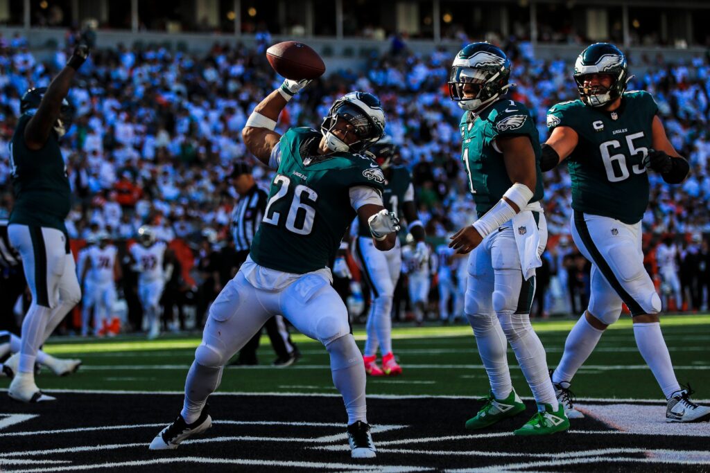 Philadelphia Eagles running back Saquon Barkley (26) reacts after quarterback Jalen Hurts (1) scores a touchdown against the Cincinnati Bengals in the second half at Paycor Stadium.