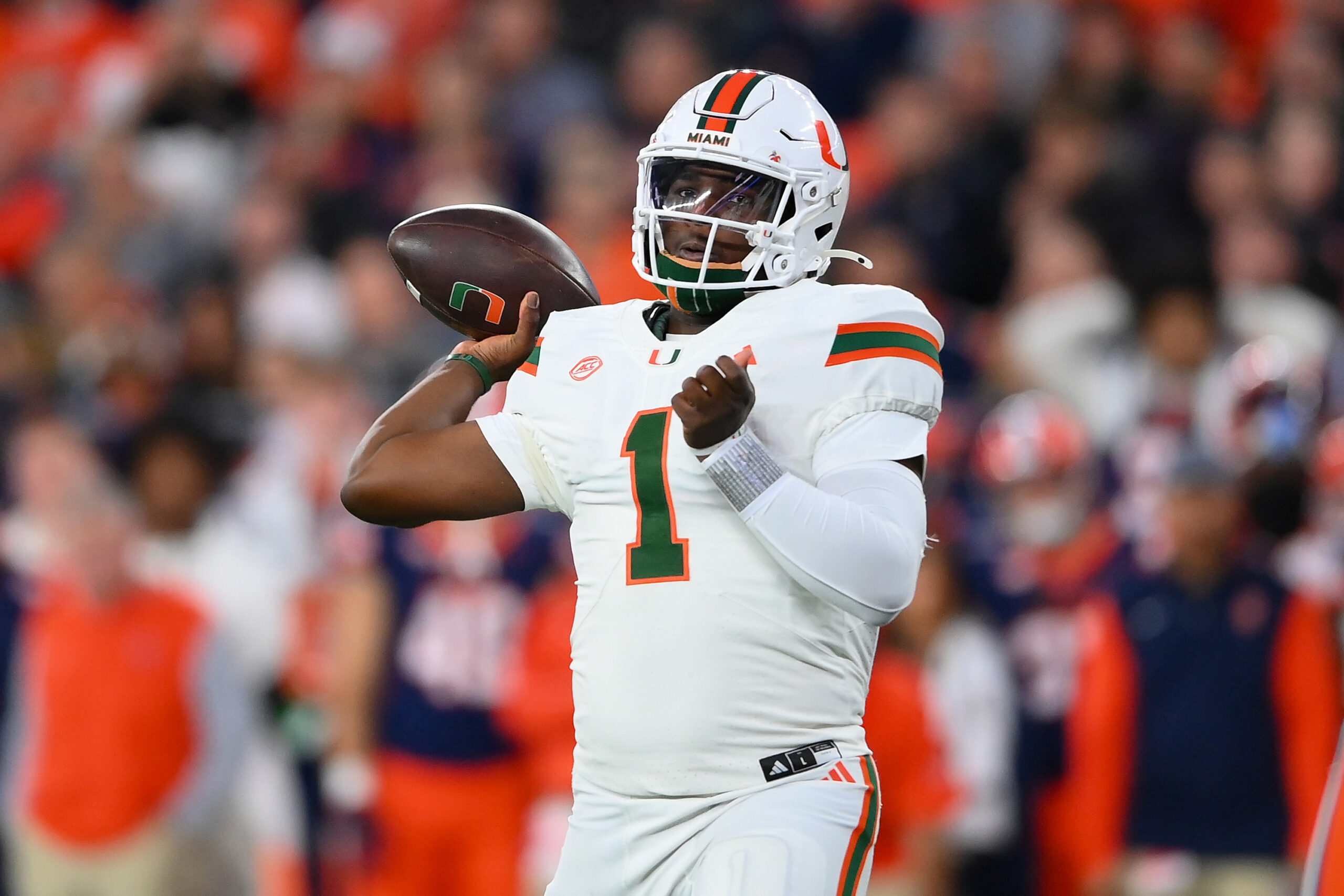 Miami Hurricanes quarterback Cam Ward (1) passes the ball against the Syracuse Orange during the first half at the JMA Wireless Dome.