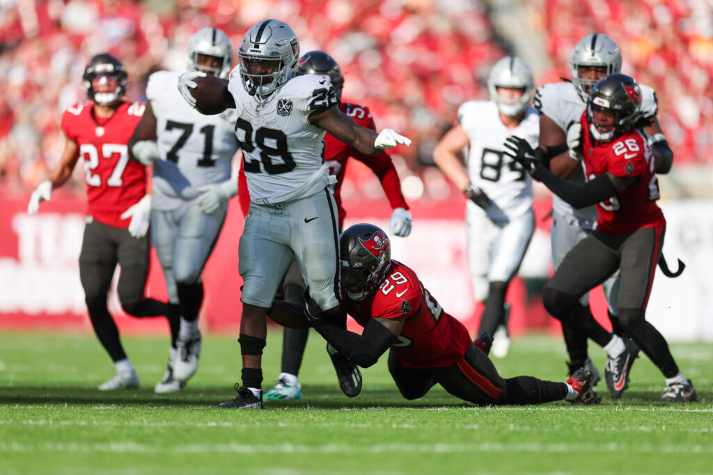 Las Vegas Raiders running back Sincere McCormick (28) runs with the ball against the Tampa Bay Buccaneers in the third quarter at Raymond James Stadium. 