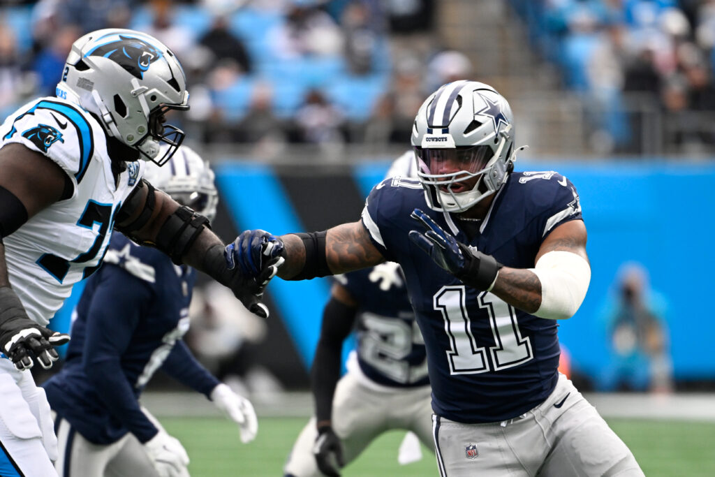 Dallas Cowboys linebacker Micah Parsons (11) rushes as Carolina Panthers offensive tackle Taylor Moton (72) defends in the first quarter at Bank of America Stadium. 