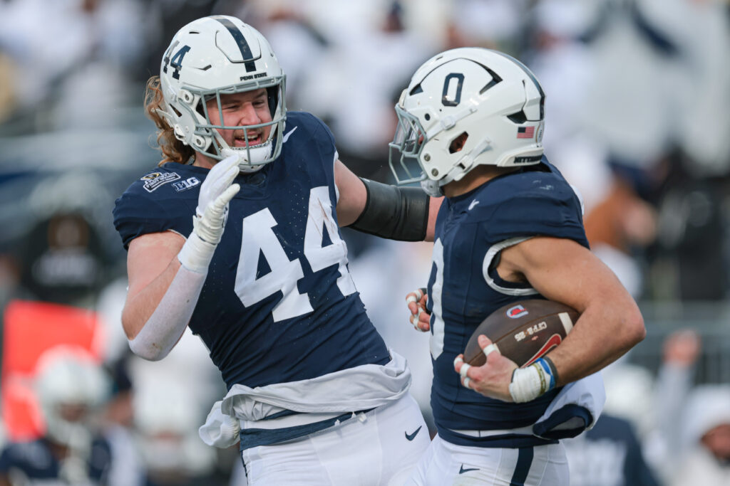 Penn State Nittany Lions tight end Tyler Warren (44) celebrates with linebacker Dominic DeLuca (0) after an interception for a touchdown during the first half against the Southern Methodist Mustangs at Beaver Stadium.