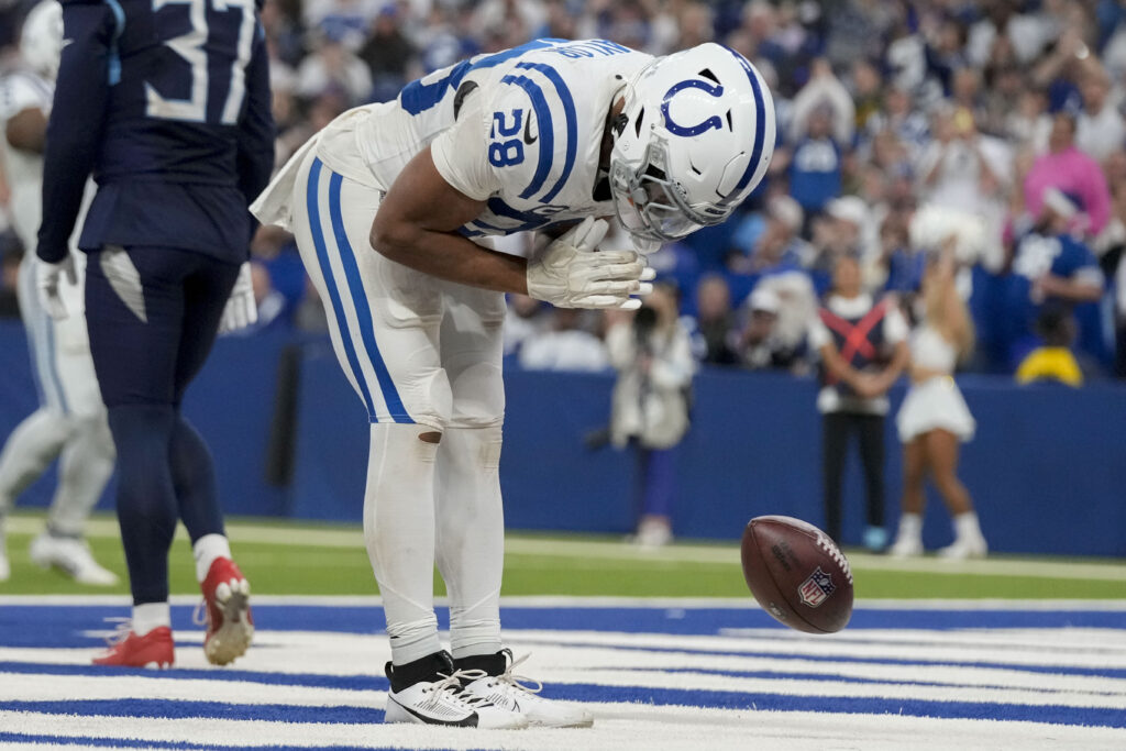 Indianapolis Colts running back Jonathan Taylor (28) celebrates after rushing for a touchdown during a game against the Tennessee Titans at Lucas Oil Stadium.