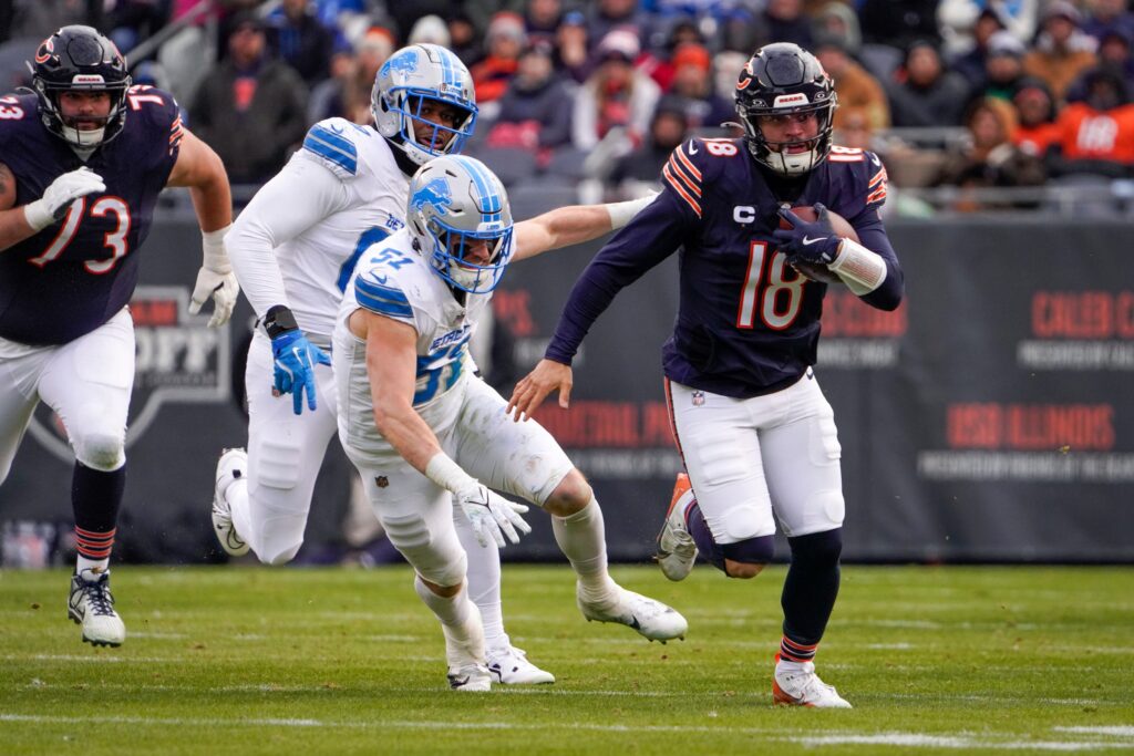 Chicago Bears quarterback Caleb Williams (18) makes a run at Soldier Field during a game against the Detroit Lions in Chicago, Ill.