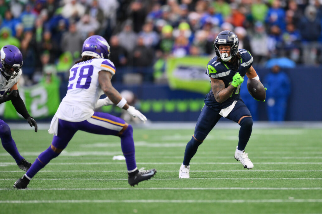 Seattle Seahawks wide receiver Jaxon Smith-Njigba (11) carries the ball after a catch against the Minnesota Vikings during the second half at Lumen Field. 