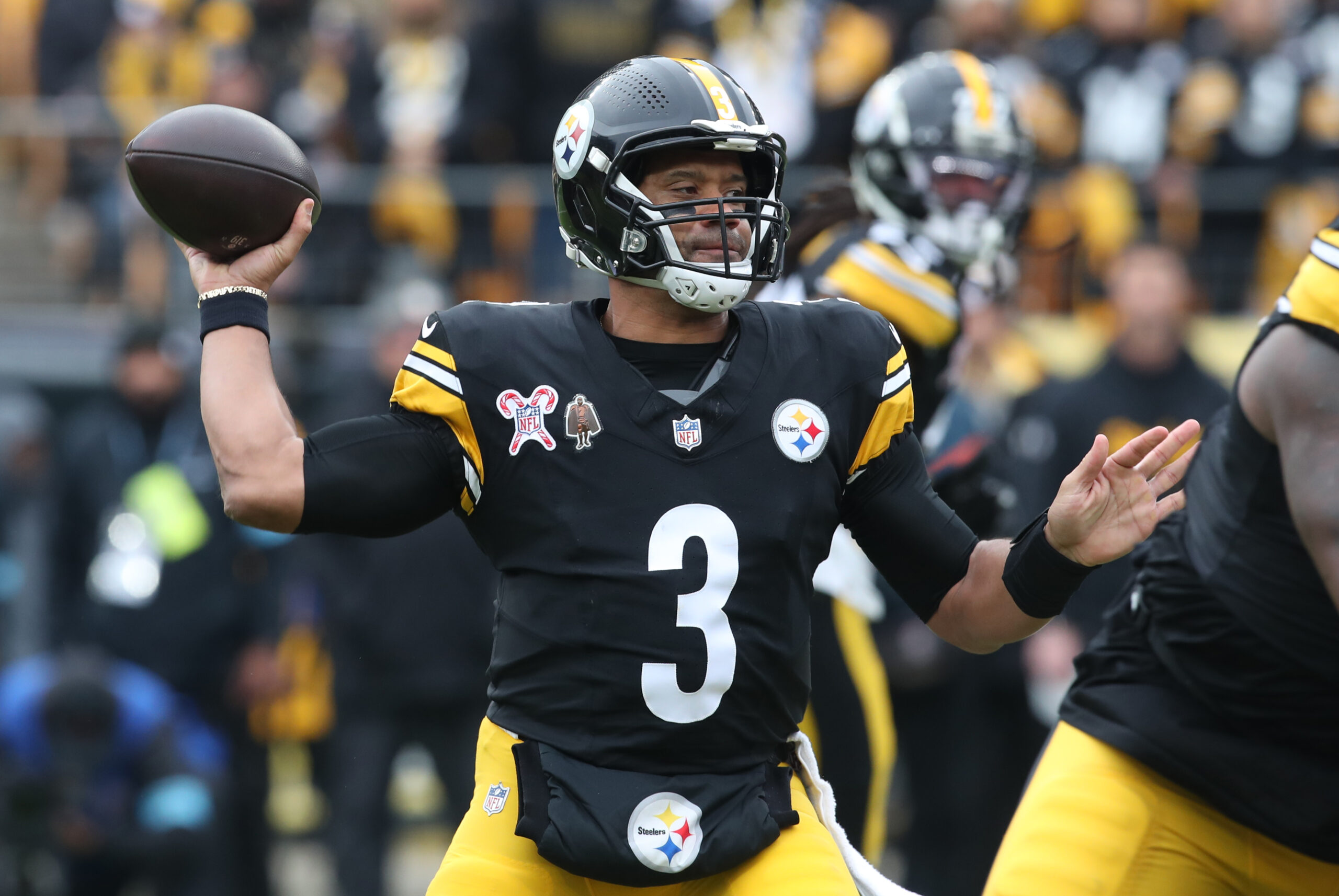 Pittsburgh Steelers quarterback Russell Wilson (3) passes against the Kansas City Chiefs during the first quarter at Acrisure Stadium.