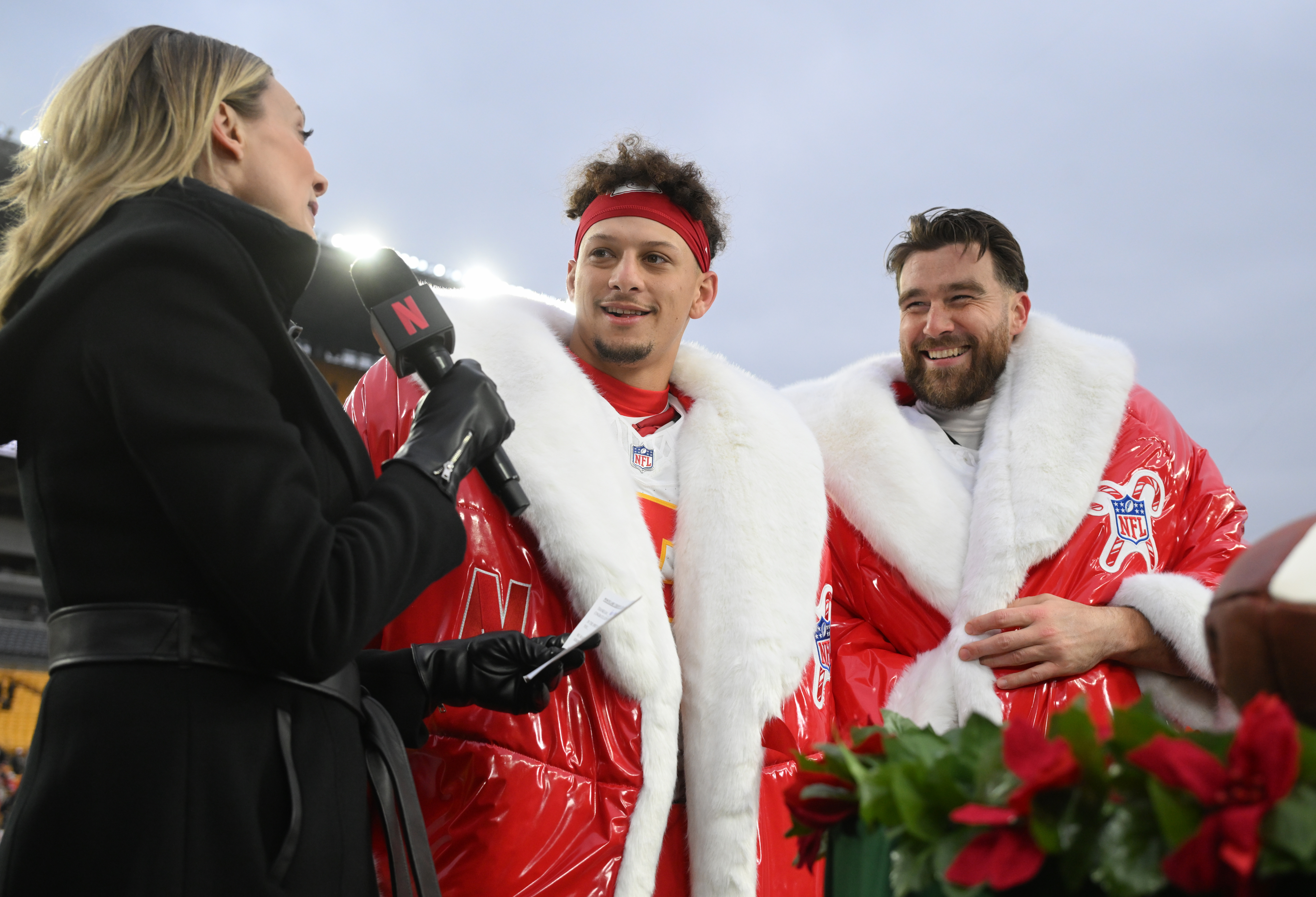 Kansas City Chiefs quarterback Patrick Mahomes (15) and tight end Travis Kelce (87) are interviewed by Netflix reporter Stacey Dales.