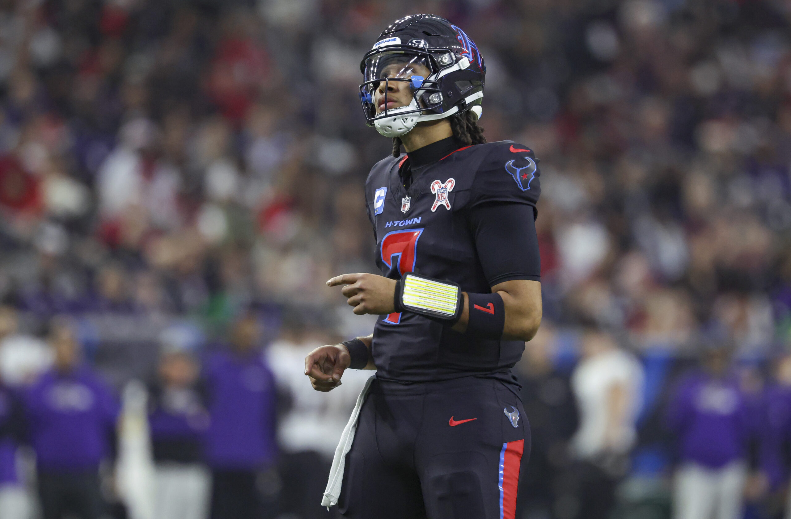 Houston Texans quarterback C.J. Stroud (7) looks up after a play during the second quarter against the Baltimore Ravens at NRG Stadium.