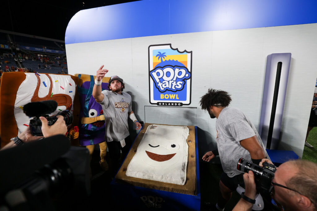 Iowa State Cyclones quarterback Rocco Becht (3) celebrates after beating Miami Hurricanes in the Pop Tarts bowl at Camping World Stadium. 