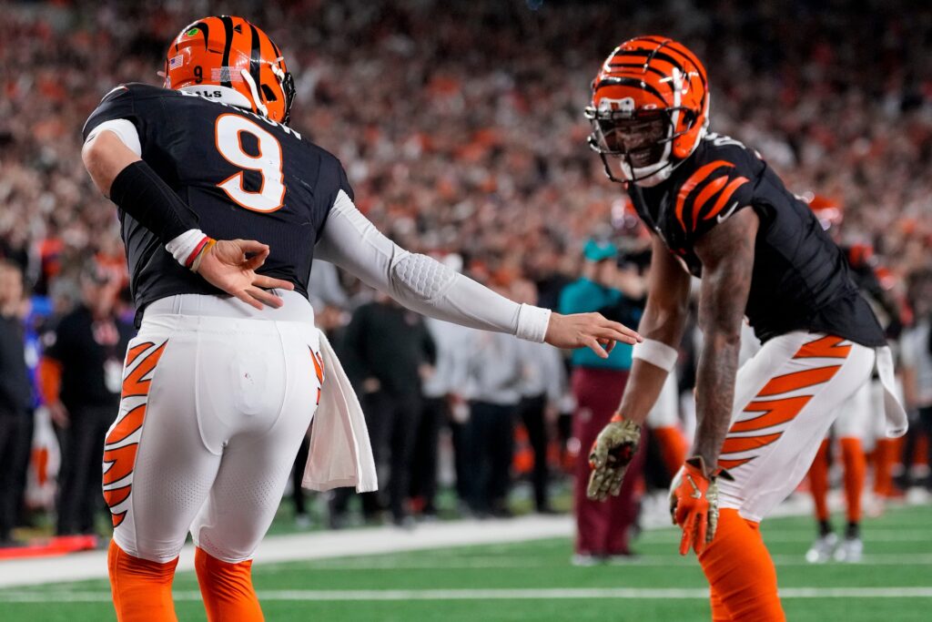 Cincinnati Bengals quarterback Joe Burrow (9) celebrates a touchdown on a QB sneak up the middle in the fourth quarter of the NFL Week 17 game between the Cincinnati Bengals and the Denver Broncos at Paycor Stadium in downtown Cincinnati.