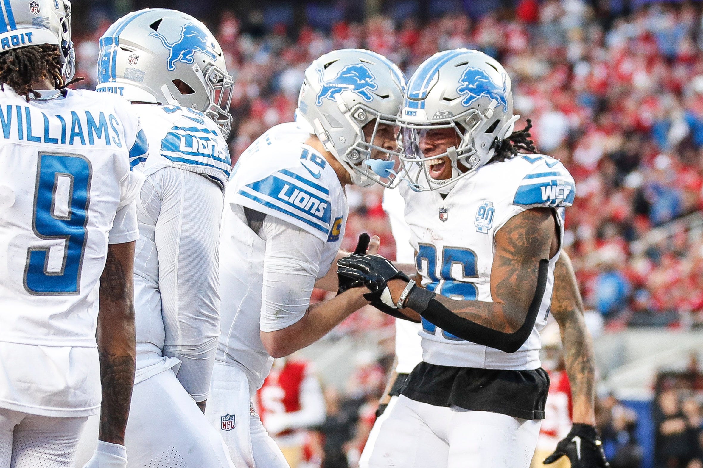 Lions running back Jahmyr Gibbs, right, celebrates a touchdown against 49ers with quarterback Jared Goff at Levi's Stadium.