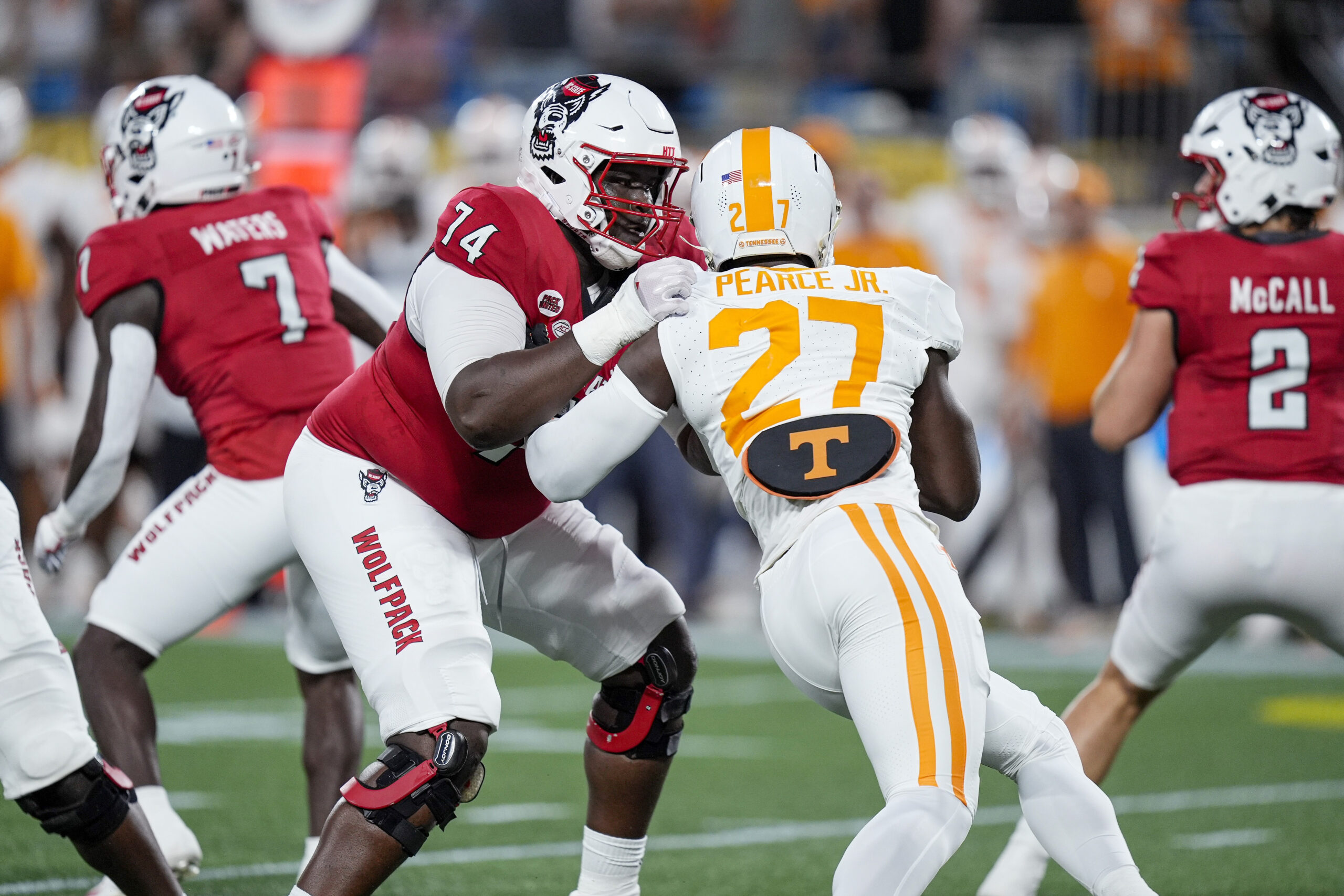 North Carolina State Wolfpack offensive tackle Anthony Belton (74) blocks Tennessee Volunteers defensive lineman James Pearce Jr. (27).