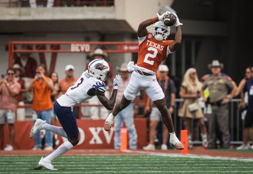 Texas Longhorns wide receiver Matthew Golden (2) catches a pass over UTSA Roadrunners cornerback Zah Frazier (3) during the first quarter at Darrell K RoyalÐTexas Memorial Stadium.