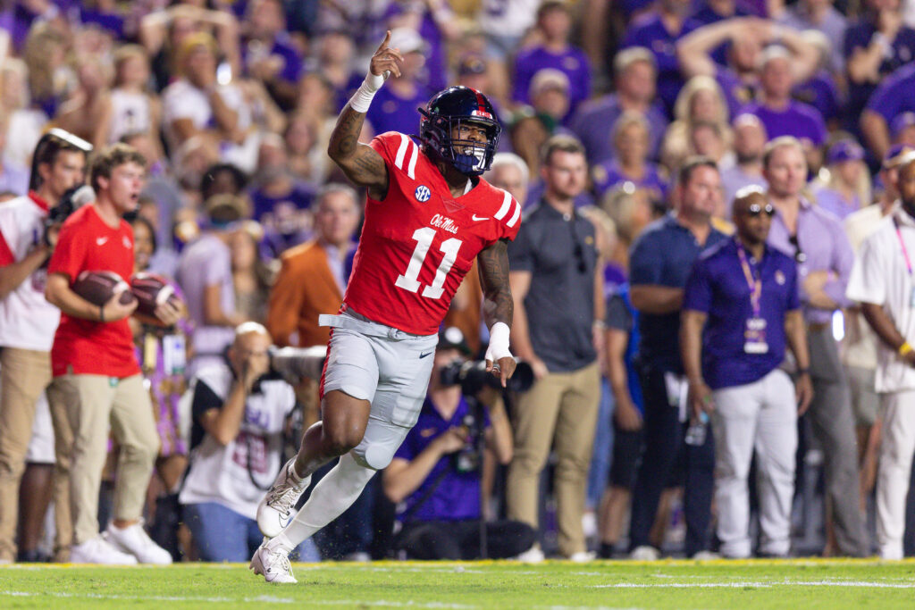 Mississippi Rebels linebacker Chris Paul Jr. (11) reacts after an interception by defensive tackle Jamarious Brown (not pictured) against the LSU Tigers at Tiger Stadium.