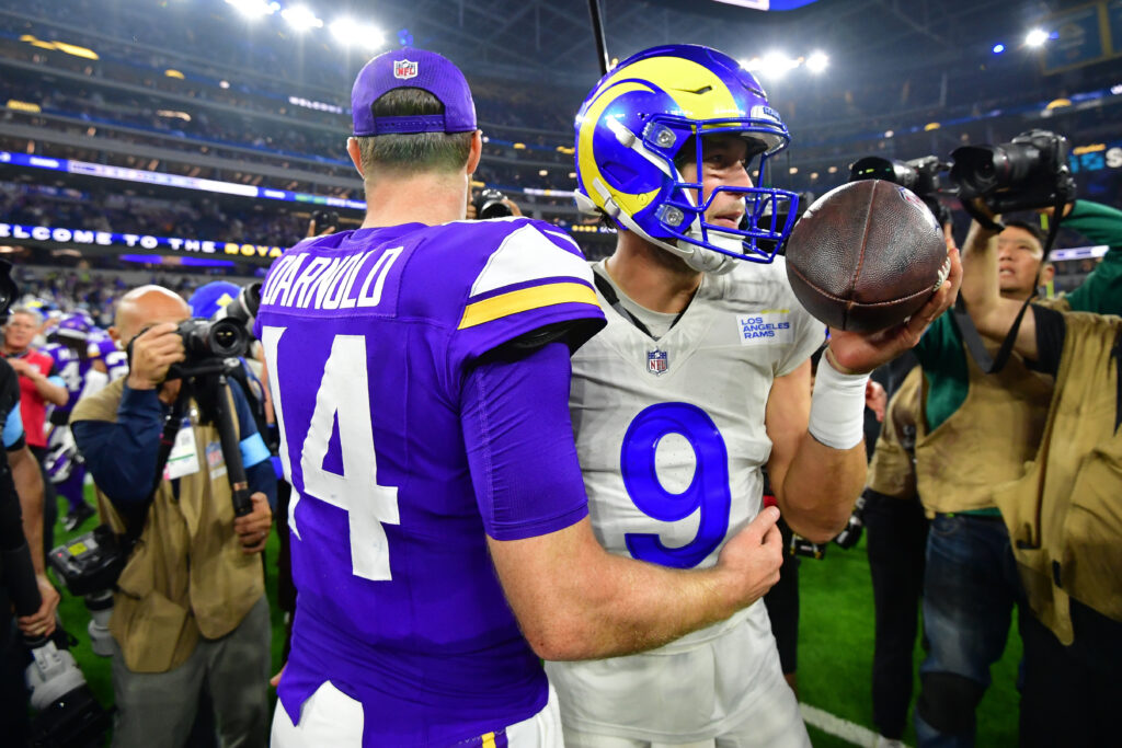 Minnesota Vikings quarterback Sam Darnold (14) meets with Los Angeles Rams quarterback Matthew Stafford (9) following the game at SoFi Stadium.