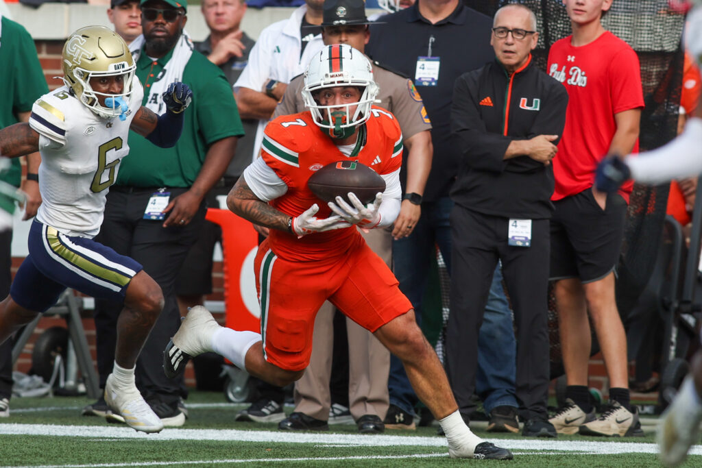 Miami Hurricanes wide receiver Xavier Restrepo (7) catches a pass for a touchdown against the Georgia Tech Yellow Jackets in the fourth quarter at Bobby Dodd Stadium.