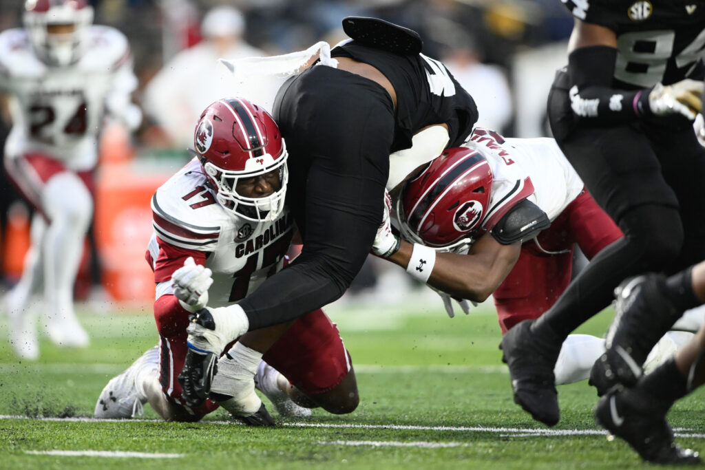 South Carolina Gamecocks linebacker Demetrius Knight Jr. (17) and linebacker Debo Williams (0) tackles Vanderbilt Commodores running back Sedrick Alexander (28) during the first half at FirstBank Stadium.  