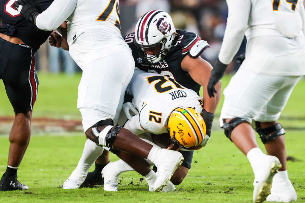 South Carolina Gamecocks defensive tackle T.J. Sanders (90) sacks Missouri Tigers quarterback Brady Cook (12) in the second quarter at Williams-Brice Stadium. 