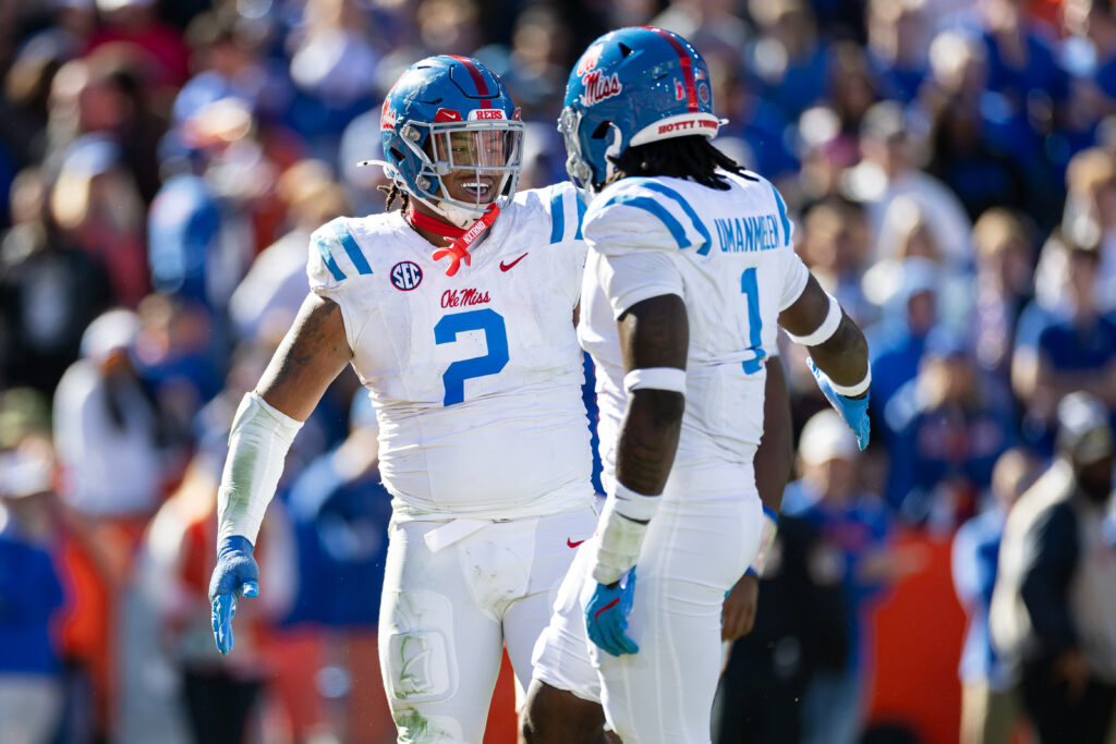 Mississippi Rebels defensive tackle Walter Nolen (2) and defensive end Princely Umanmielen (1) celebrate a sack against the Florida Gators during the second half at Ben Hill Griffin Stadium.