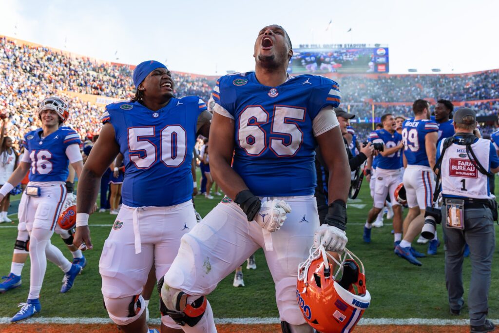 Florida Gators offensive lineman Brandon Crenshaw-Dickson (65) celebrates with offensive lineman Jason Zandamela (50) after a game against the Mississippi Rebels.