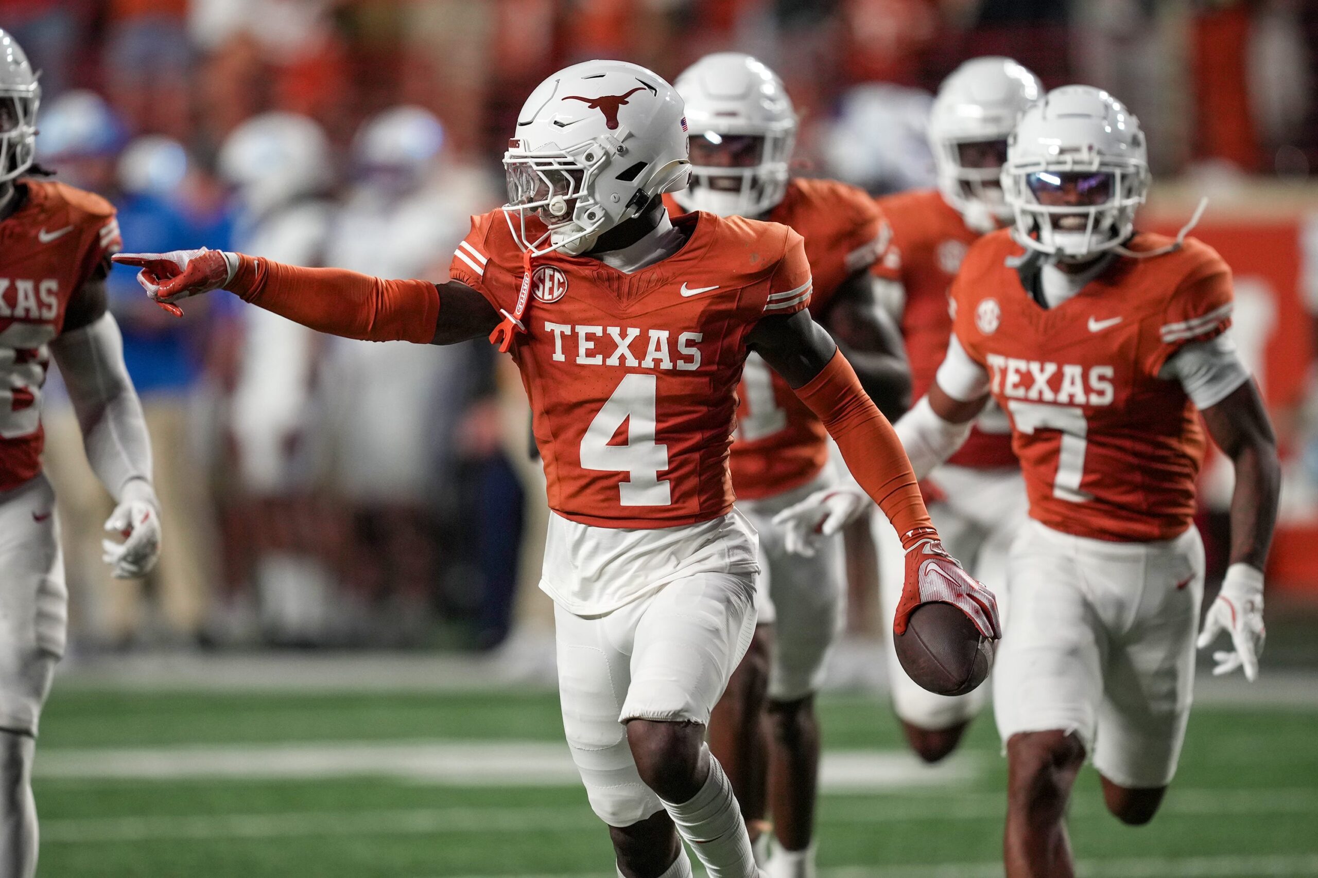 Texas Longhorns defensive back Andrew Mukuba (4) celebrates a interception against Kentucky Wildcats late in the fourth quarter at Darrell K Royal Texas Memorial Stadium, Austin, Texas.