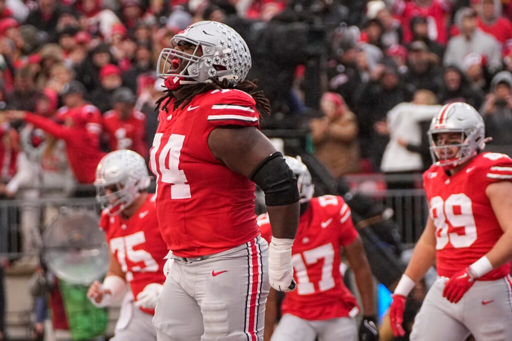 Ohio State Buckeyes offensive lineman Donovan Jackson (74) celebrates a touchdown by TreVeyon Henderson against the Indiana Hoosiers at Ohio Stadium in Columbus.