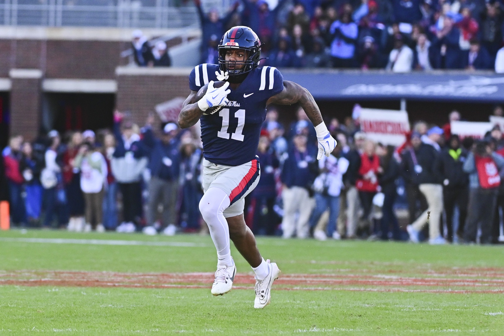 Mississippi Rebels linebacker Chris Paul Jr. (11) runs the ball after an interception against the Mississippi State Bulldogs during the first quarter at Vaught-Hemingway Stadium.