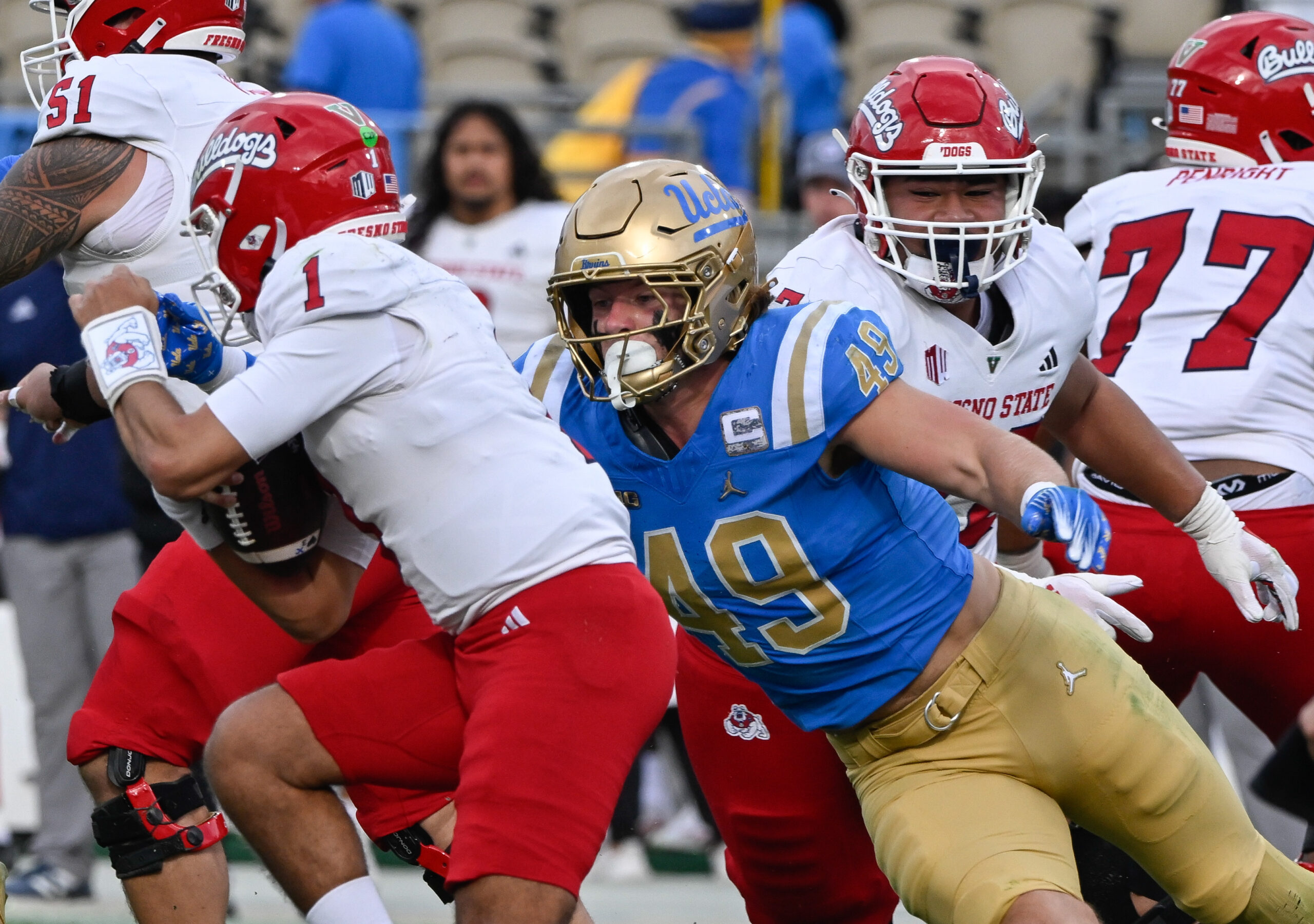 UCLA Bruins linebacker Carson Schwesinger (49) sacks Fresno State Bulldogs quarterback Mikey Keene (1) during the second quarter at Rose Bowl.