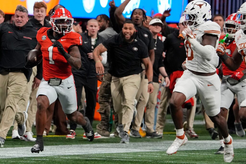 Georgia running back Trevor Etienne (1) breaks away for a big gain during the second half of the SEC championship game against Texas.