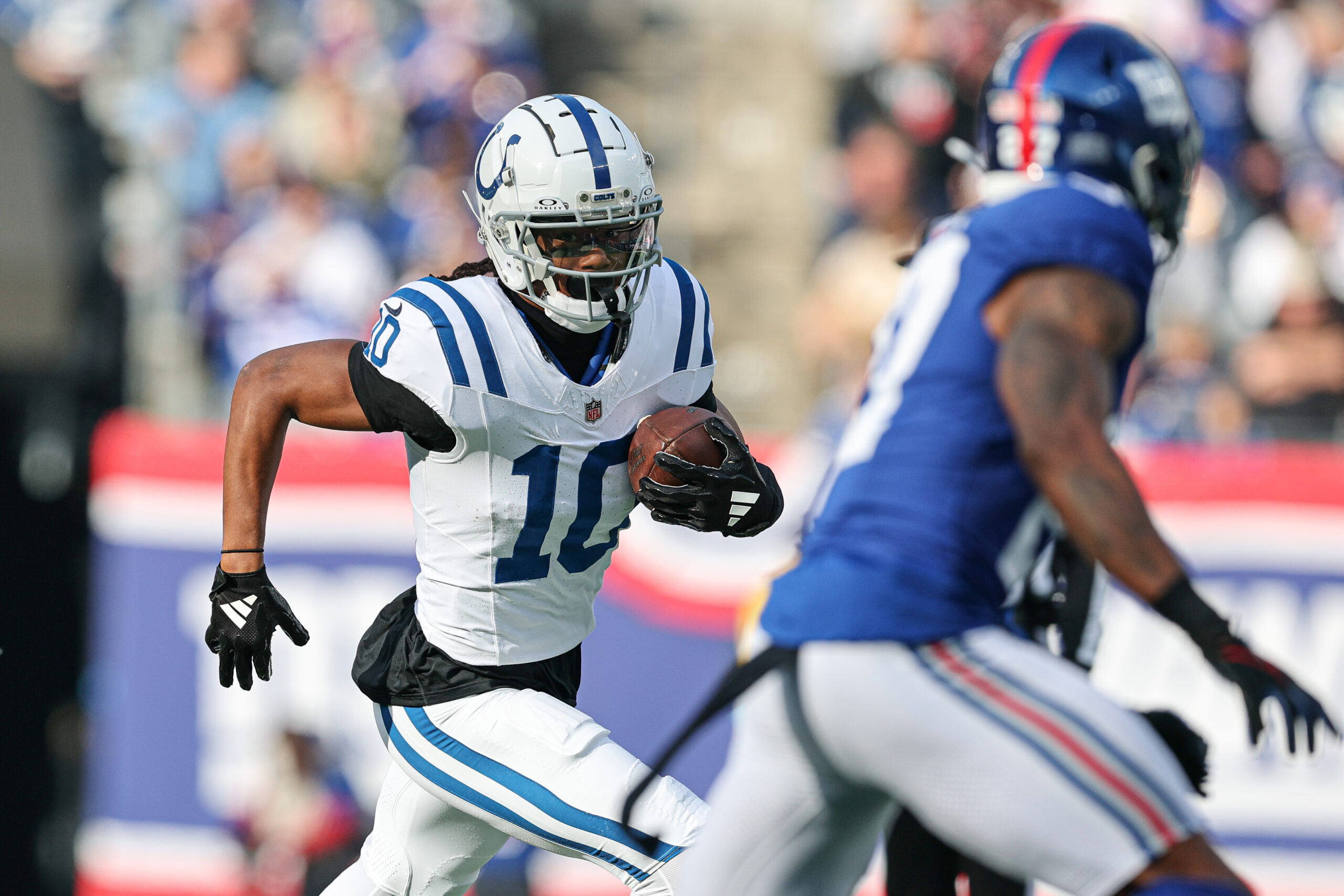 Indianapolis Colts wide receiver Adonai Mitchell (10) gains yards after catch during the first half against the New York Giants at MetLife Stadium.