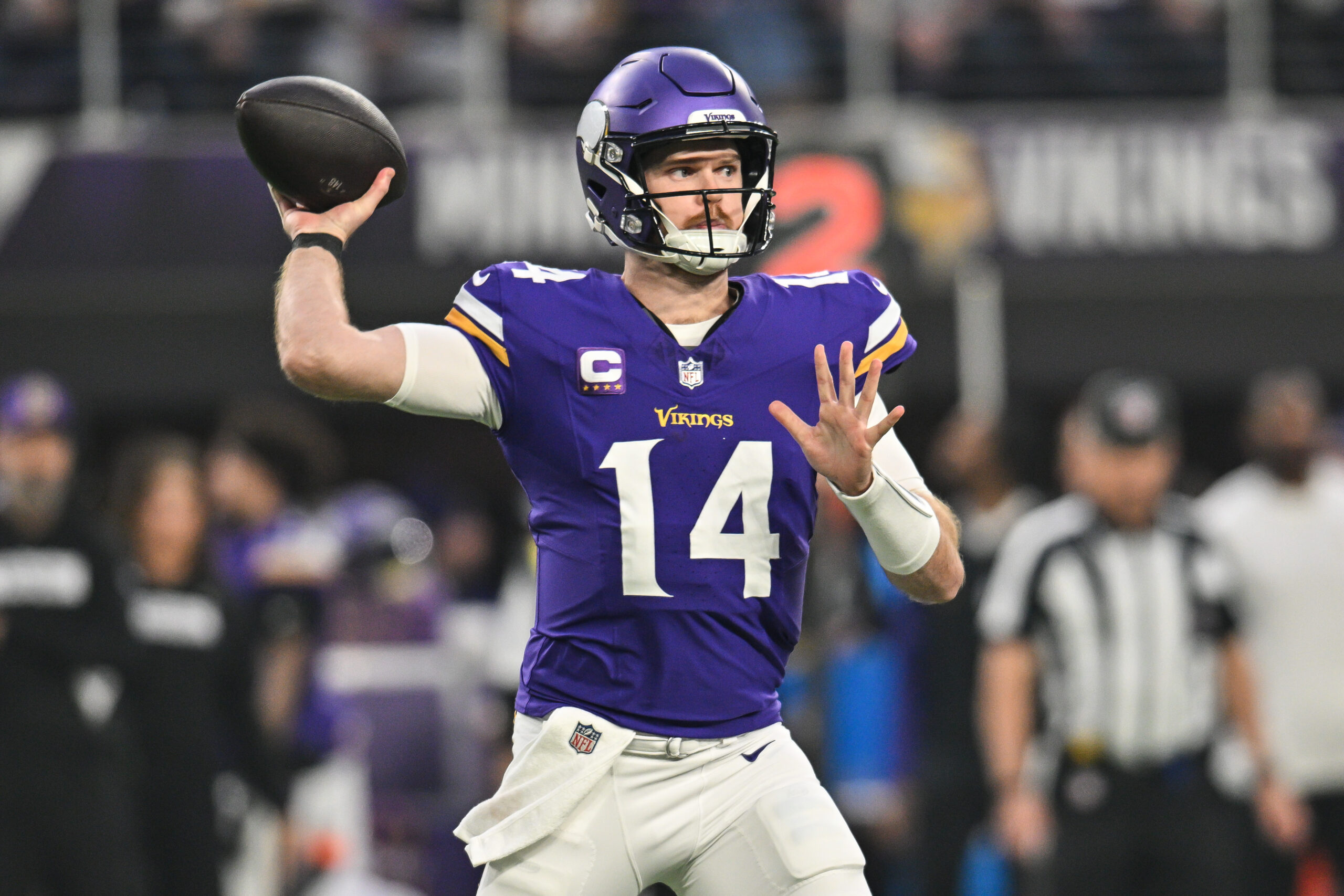 Minnesota Vikings quarterback Sam Darnold (14) throws a pass against the Green Bay Packers at U.S. Bank Stadium.