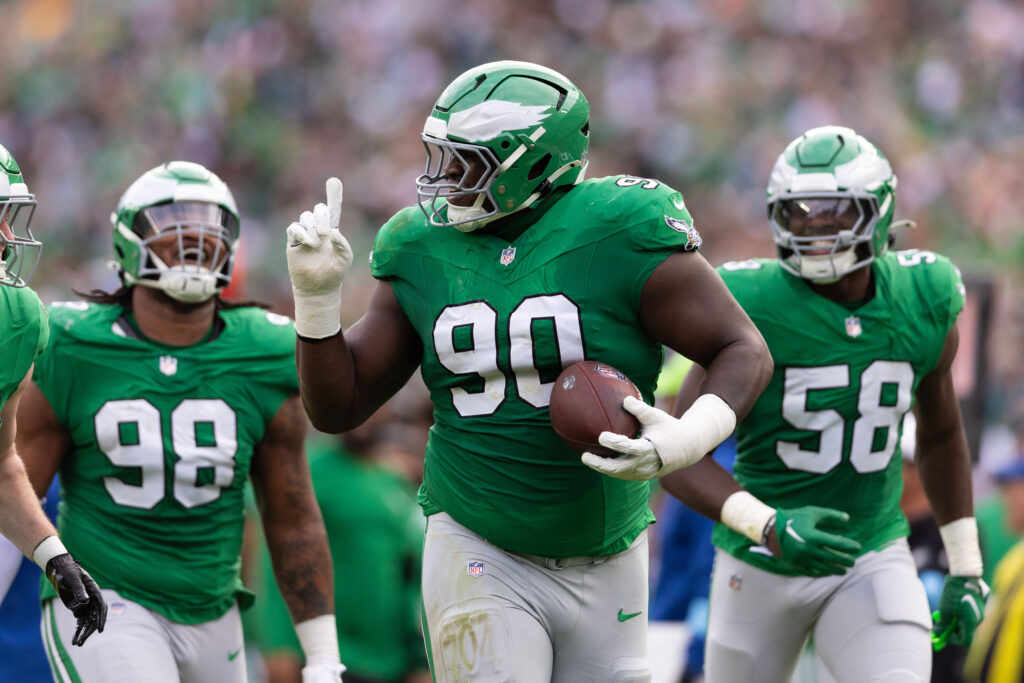 Philadelphia Eagles defensive tackle Jordan Davis (90) celebrate with teammates after his fumble recovery against the Dallas Cowboys during the second quarter at Lincoln Financial Field. 