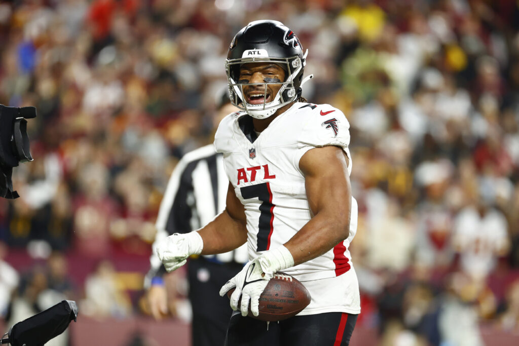 Atlanta Falcons running back Bijan Robinson (7) celebrates after scoring a touchdown against the Washington Commanders during the first half at Northwest Stadium.