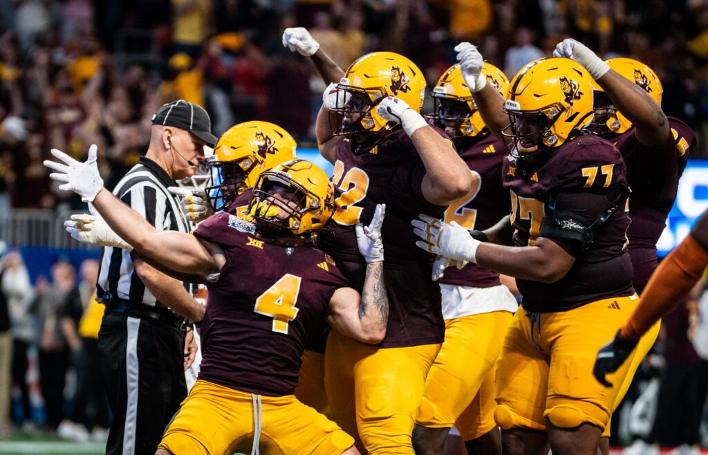 Arizona State celebrate together after Arizona State Sun Devils running back Cam Skattebo (4) scores a touchdown in the fourth quarter in the Peach Bowl College Football Playoff quarterfinal at Mercedes-Benz Stadium in Atlanta, Georgia.