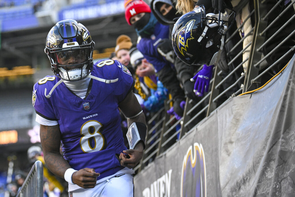 Baltimore Ravens quarterback Lamar Jackson (8) looks towards the crowds while entering the field before the game against the Cleveland Browns at M&T Bank Stadium.