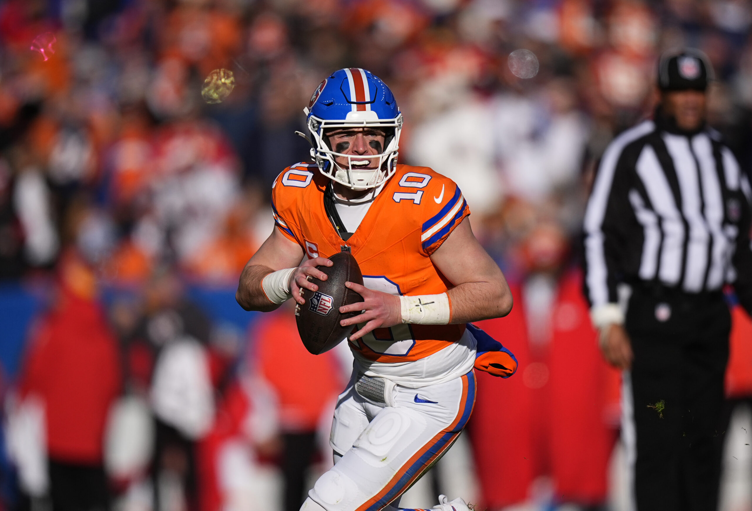 Denver Broncos quarterback Bo Nix (10) prepares to pass the ball in the first quarter against the Kansas City Chiefs at Empower Field at Mile High.