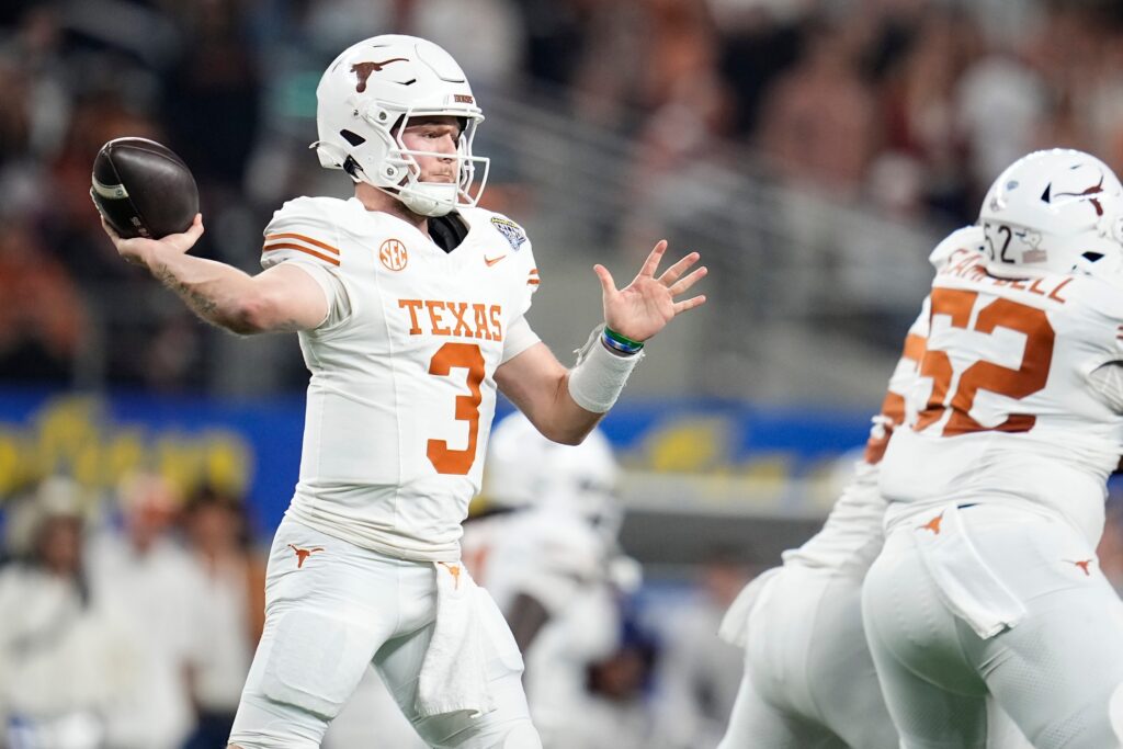 Texas Longhorns quarterback Quinn Ewers (3) throws during the first half of the Cotton Bowl Classic College Football Playoff semifinal game against the Ohio State Buckeyes.