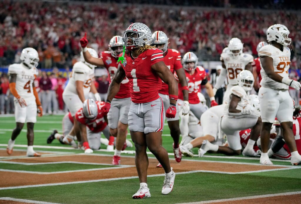 Ohio State Buckeyes running back Quinshon Judkins (1) celebrates his touchdown run against Texas Longhorns in the fourth quarter of the Cotton Bowl Classic during the College Football Playoff.